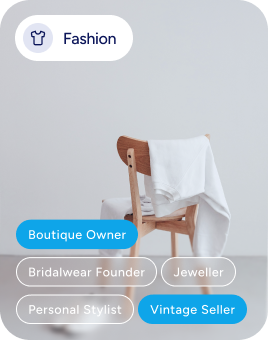 Fashion category interface showing audience segment tags including Boutique Owner, Bridalwear Founder, Jeweller, Personal Stylist, and Vintage Seller, with a minimalist white garment draped over a wooden chair in the background.